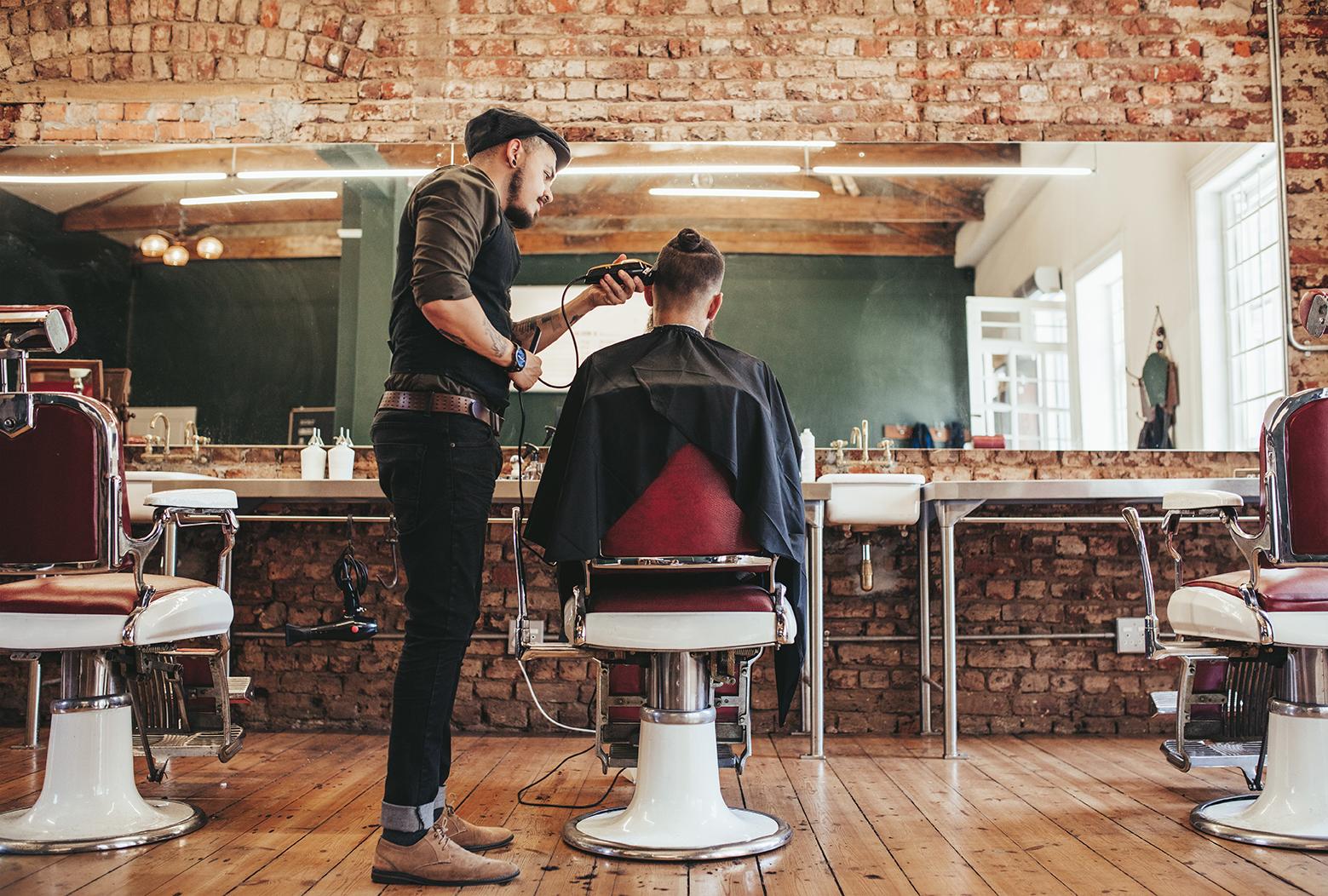 Image of barber giving haircut
